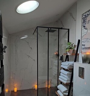 Shower, hair dryer, towels, soap