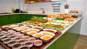 A buffet with various food items and condiments. - Maslin Otel (Gökçeada)
