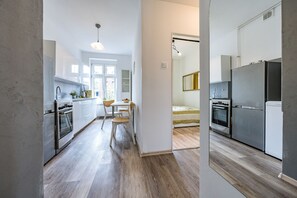 Appartement Confort | Coin séjour | Télévision à écran plat
