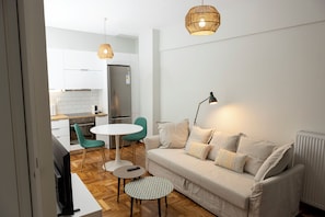 Apartamento superior | Área de estar | Smart TV 55 polegadas com canais a cabo