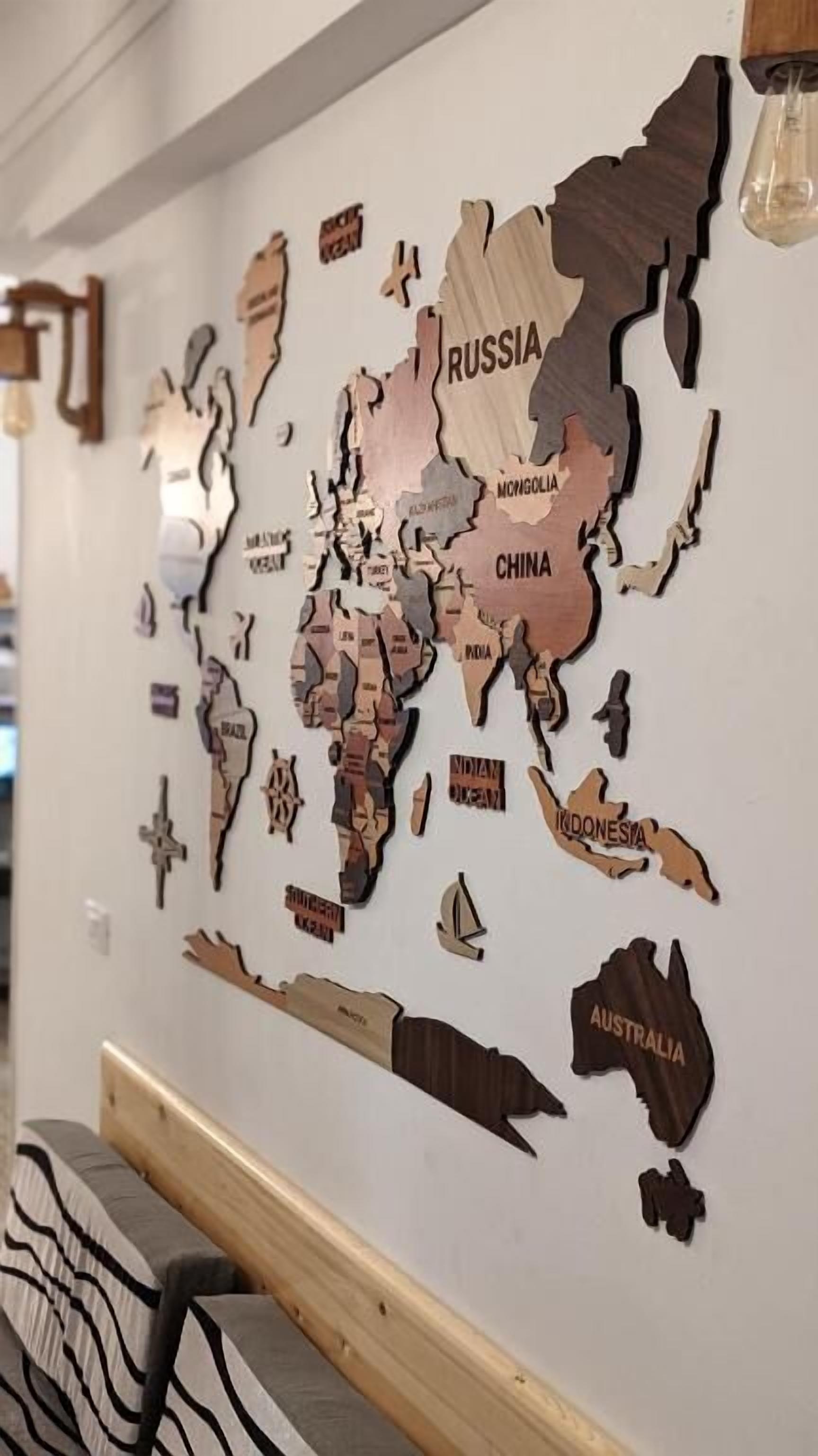 A wall map with country outlines and names, including Russia, China, India, and Australia.