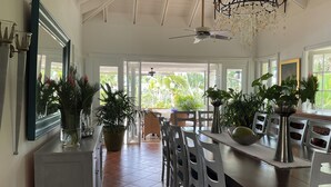 A spacious dining area with a high ceiling, a chandelier, and potted plants. - "srvittinivillas Lc01  Resorts / Spacious/ Family/ Group/ Best Loc" (La Romana)