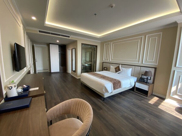 Deluxe Double or Twin Room | Minibar, desk, laptop workspace, blackout drapes