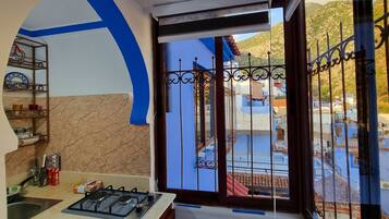 Panoramic Suite | Private kitchen | Espresso maker, coffee/tea maker, electric kettle, dining tables