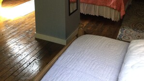 A bedroom with a bed, a mirror, and a window with curtains. - Rural Vermont with internet and Smart TV, cell phone works,  Dogs welcome. (Washington)