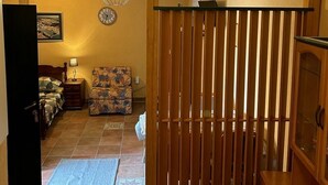A room with a bed, a chair, a desk, and a wooden partition. - Studio apartment in Sukošan with Air condition, WIFI (5102-2) (Sukošan)