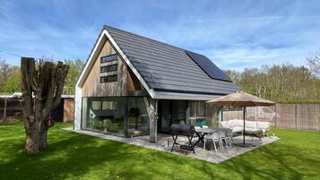 Enjoy outdoor dining and relaxation in the spacious backyard with a patio area.