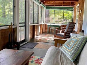 Screened in porch with a hot tub!