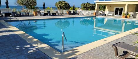 Outdoor pool, free cabanas, pool umbrellas