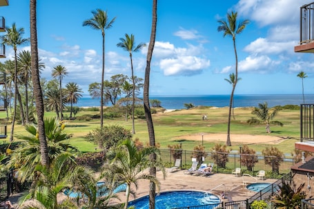 On the beach, white sand, beach umbrellas, beach towels
