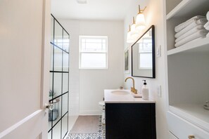 Shower, hair dryer, towels, soap