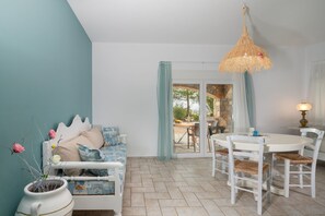 Family Apartment, 1 Bedroom, Non Smoking, Pool View | Living area | 32-inch flat-screen TV with cable channels