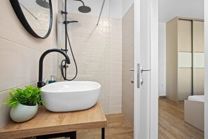 Shower, hair dryer, towels, toilet paper