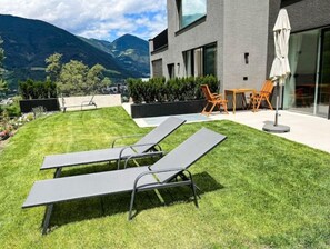Outdoor dining - modern, luxury, private entrance, garden, terrace, and stunning mountain views. (Brixen)