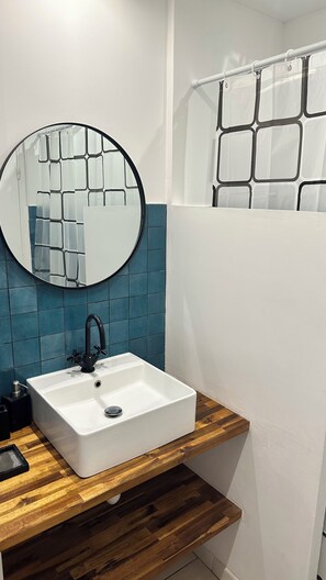 Shower, hair dryer, towels, toilet paper