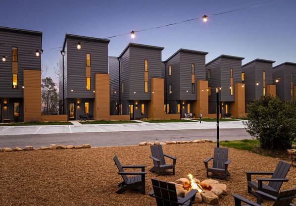 A modern building with multiple units, outdoor seating, and a fire pit. - Coachella -An Atomic Ridge Home (Chattanooga)