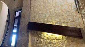 A staircase with stone walls and wooden beams, leading to an upper level. - Historic Maison du Roy/Upper Chambers 3BR/2 BR Apartment with Balcony & View (Saint-Antonin-Noble-Val)