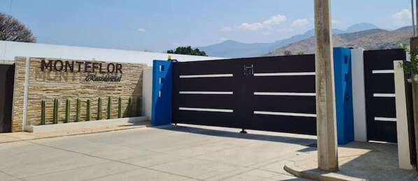 Welcome to Monte Flor Residences, where a secure entrance sets the tone for a serene retreat.