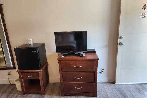 Standard Room 2 Double Beds | Living area | 32-inch LED TV with cable channels