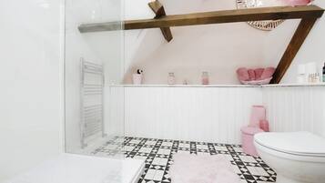 Designer toiletries, hair dryer, towels, soap