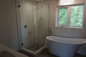 Shower, hair dryer, towels, toilet paper