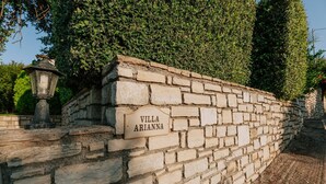 A stone wall with a sign reading 'Villa Arianna' and a lantern. - Villa Arianna With Breathtaking View Near Rethymno (Rethymno)
