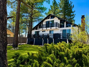 A two-story building with a balcony, surrounded by trees and a well-maintained lawn. - Big Bear Lake View (Big Bear Lake)