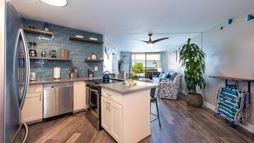 Luxury Condo | Private kitchen | Full-size fridge, microwave, oven, stovetop