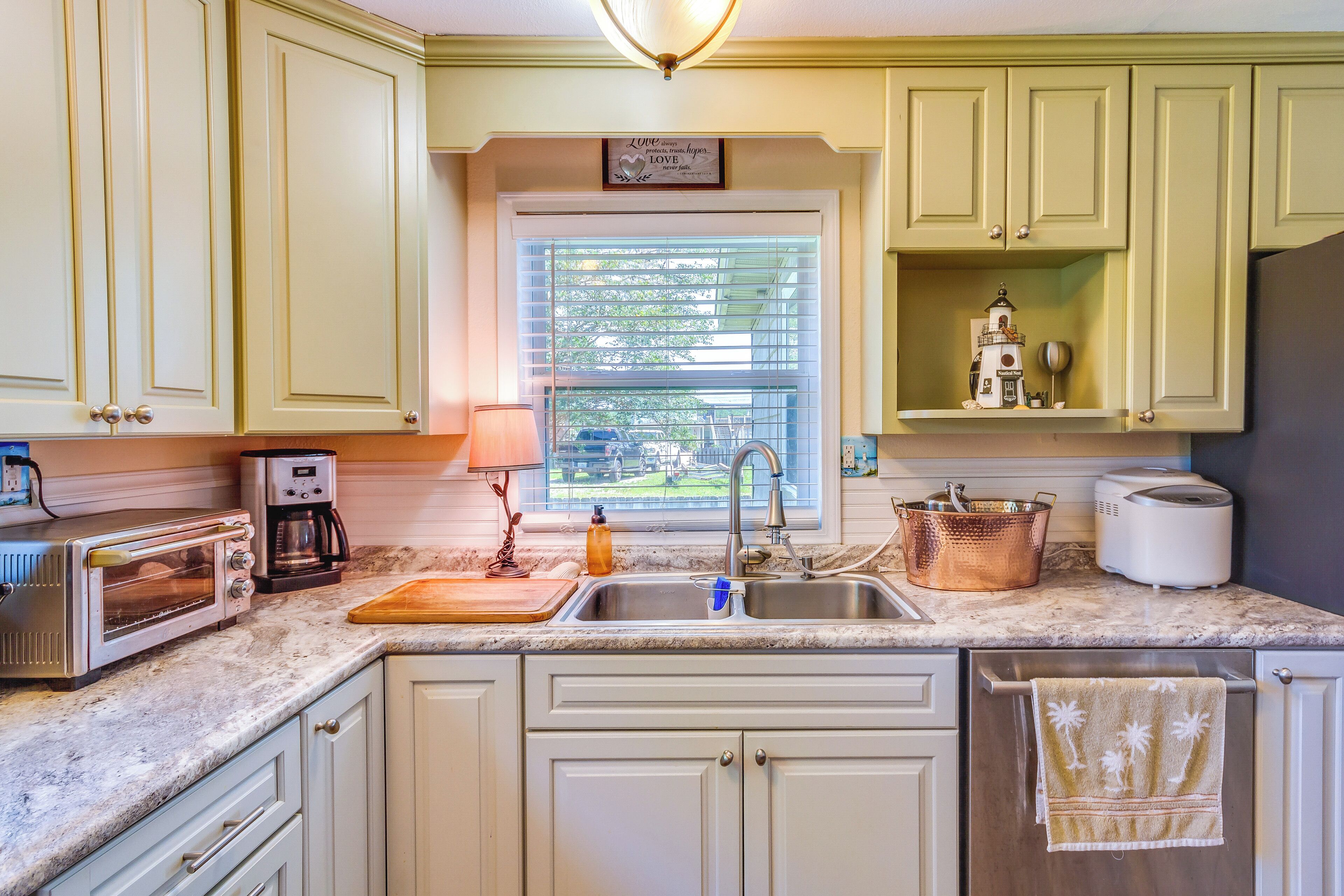 Fridge, stovetop, dishwasher, coffee/tea maker