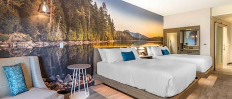 Un dormitorio con cama, sofá, una mesita redonda y un amplio mural en la pared que muestra un bosque y un lago.