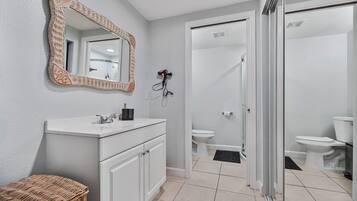 Shower, hair dryer, towels, soap