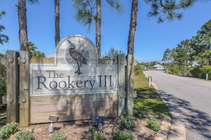 Welcome to The Rookery III, a charming retreat surrounded by lush gardens and a scenic view.