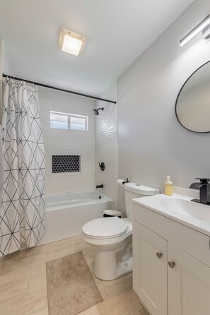 Shower, towels, soap, toilet paper