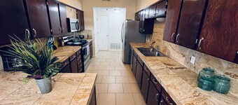 Chic brick interior condo lit by string lights