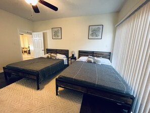 2 bedrooms, in-room safe, desk, iron/ironing board - Chic brick interior condo lit by string lights (Midland)