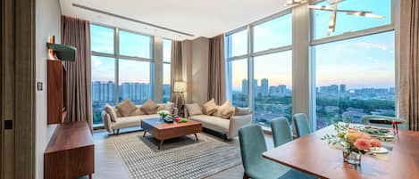 Qiu Ya One-Bedroom Elegant Suite | Living area | 55-inch LCD TV with satellite channels, toys