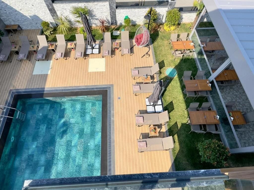 Seasonal outdoor pool, a heated pool, pool umbrellas, sun loungers