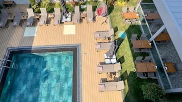 Seasonal outdoor pool, a heated pool, pool umbrellas, sun loungers