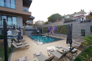 Seasonal outdoor pool, a heated pool