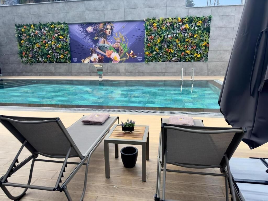 Seasonal outdoor pool, a heated pool, pool umbrellas, pool loungers