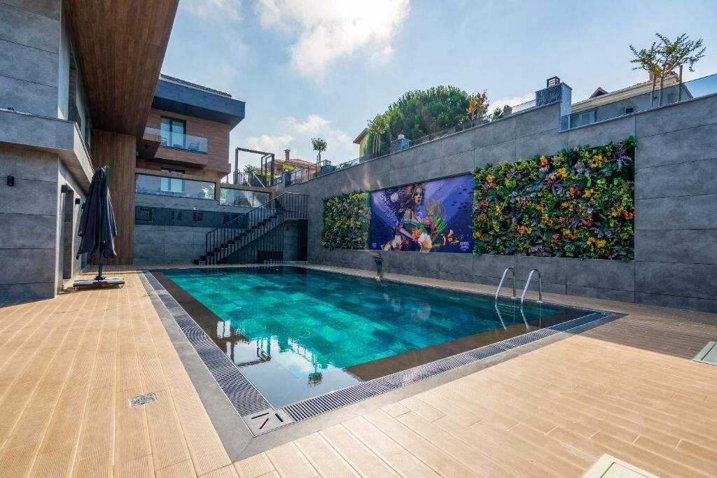 Seasonal outdoor pool, open 9:00 AM to 7:30 PM, pool umbrellas