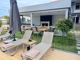 Seasonal outdoor pool, a heated pool, pool umbrellas, pool loungers