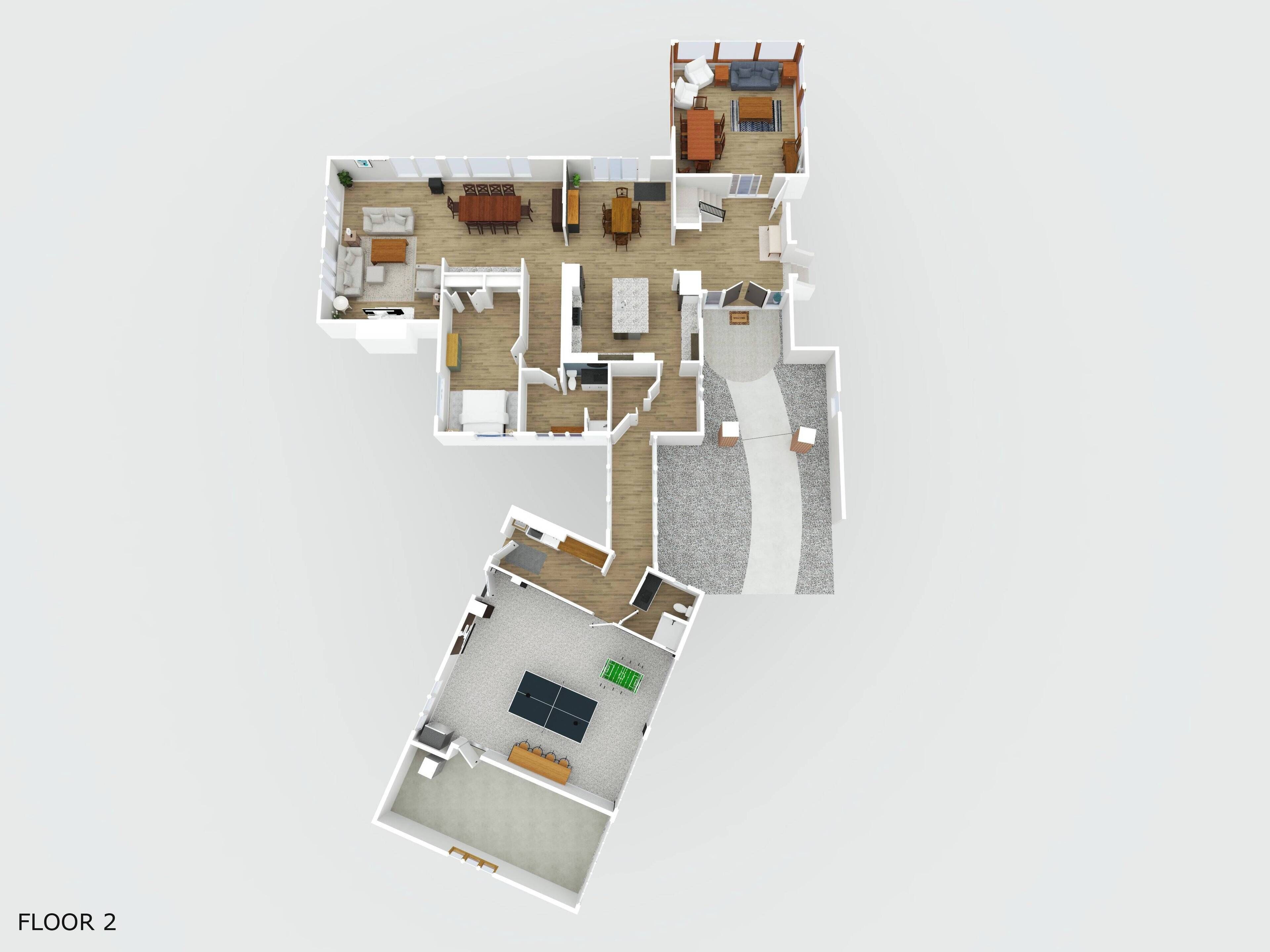 Ein 2D-Grundriss eines Hotelzimmers mit Wohnbereich, Essbereich und einem kleinen Balkon.