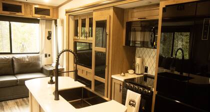 RV on 5 acres of wooded land. Sleeps six. Tent camping is available.