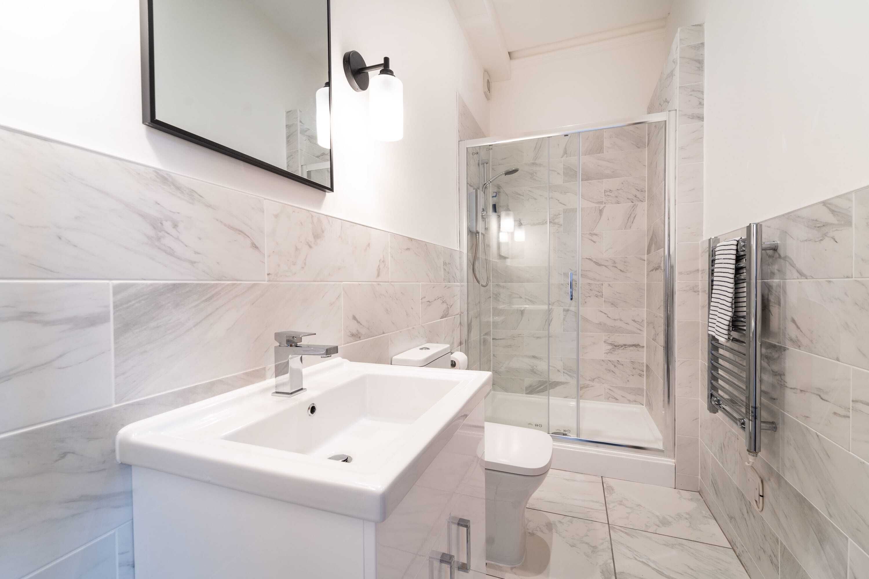 Shower, hair dryer, towels, shampoo