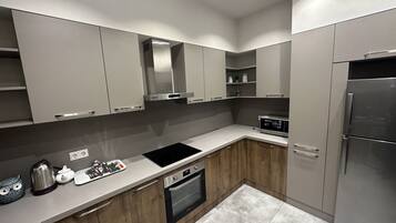 Microwave, cookware/dishes/utensils, ice maker, dining tables