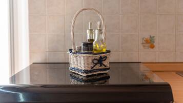 A woven basket with a handle on a reflective surface.