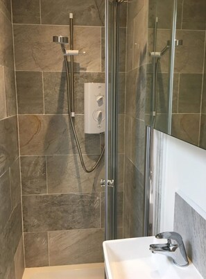 Shower, towels, soap, toilet paper