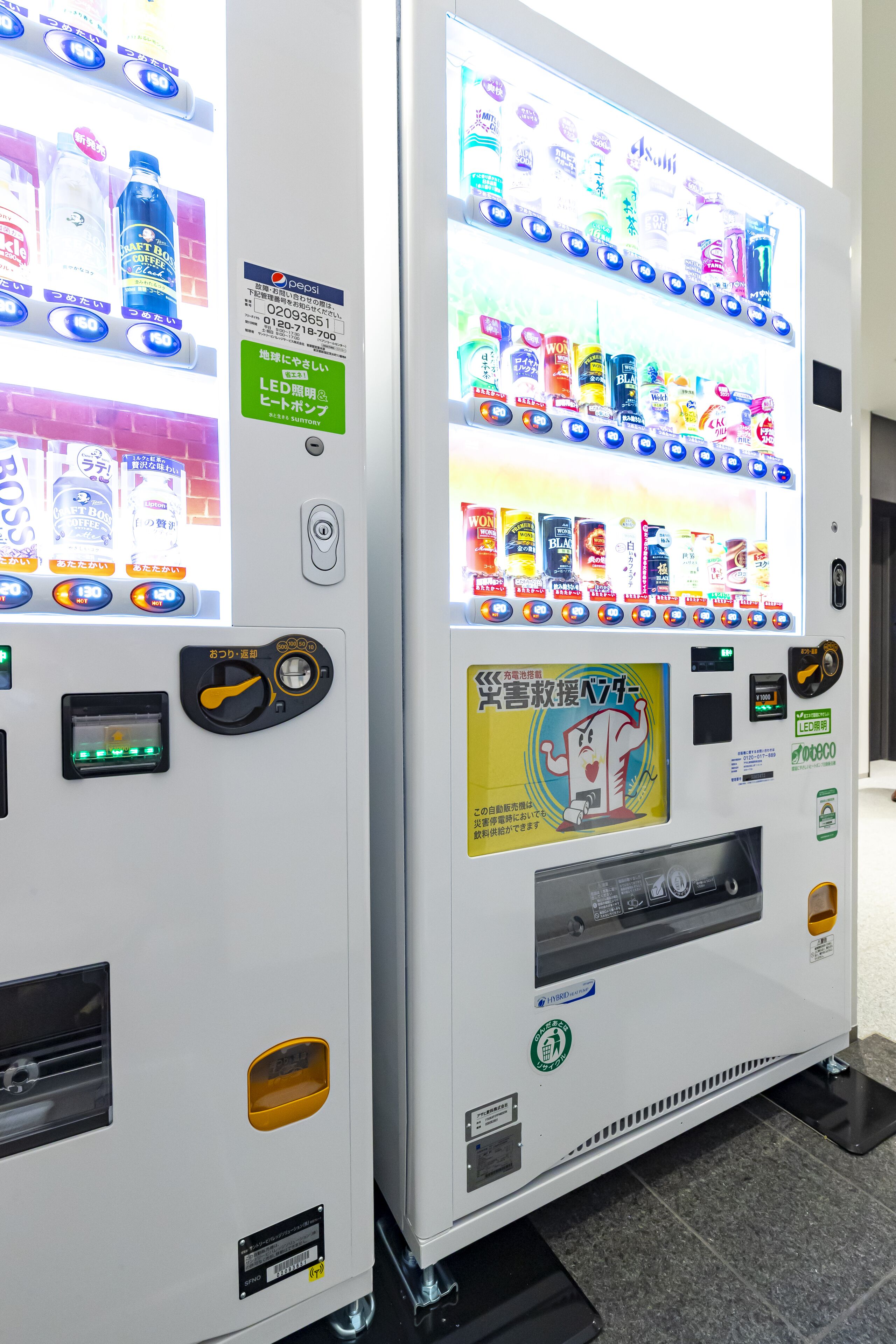 Two vending machines with various drink and snack options.
