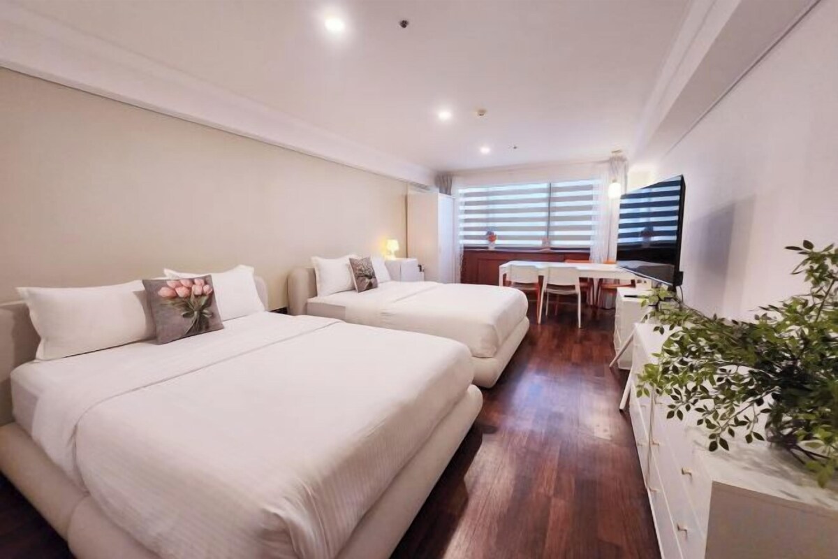Premium bedding, down comforters, desk, laptop workspace